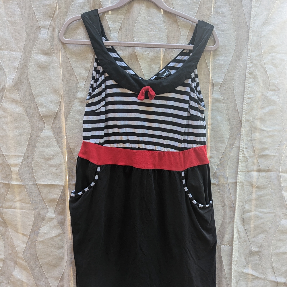 Black and White Striped Dress with Red Accent